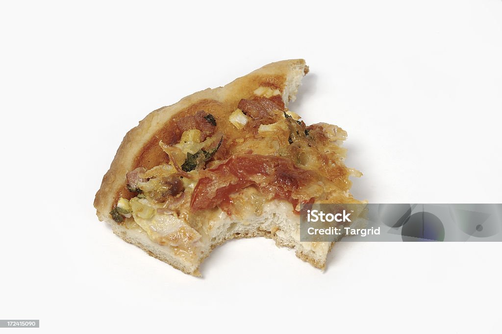 Pizza slice Photo of pizza slice half eaten. Eaten Stock Photo