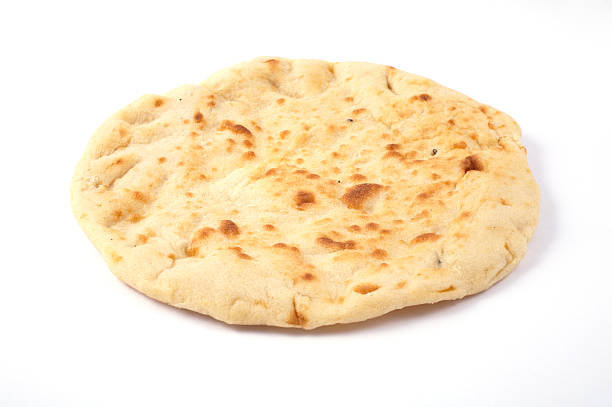 An indian naan bread on a white background stock photo