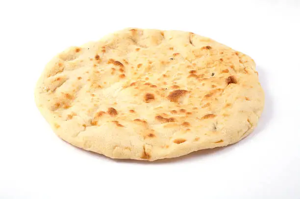 Photo of An indian naan bread on a white background