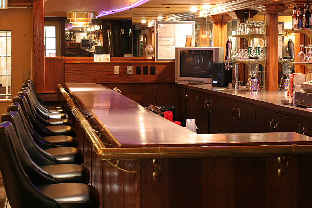 istock Liquor Bar with Neon Lights and Empty Stools 172415307