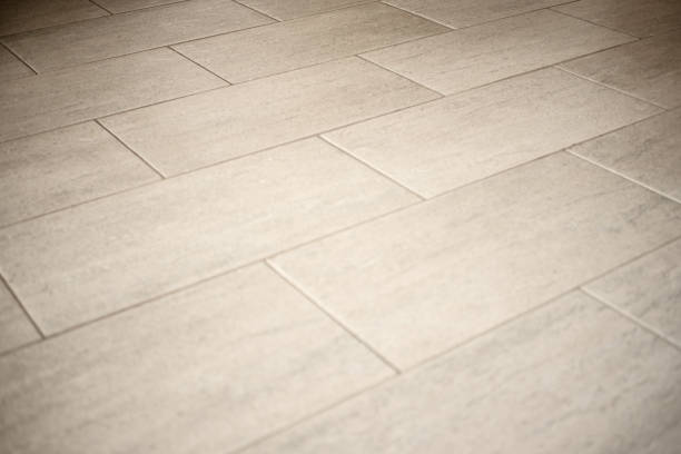 Home improvement, handyman placing tile spacer