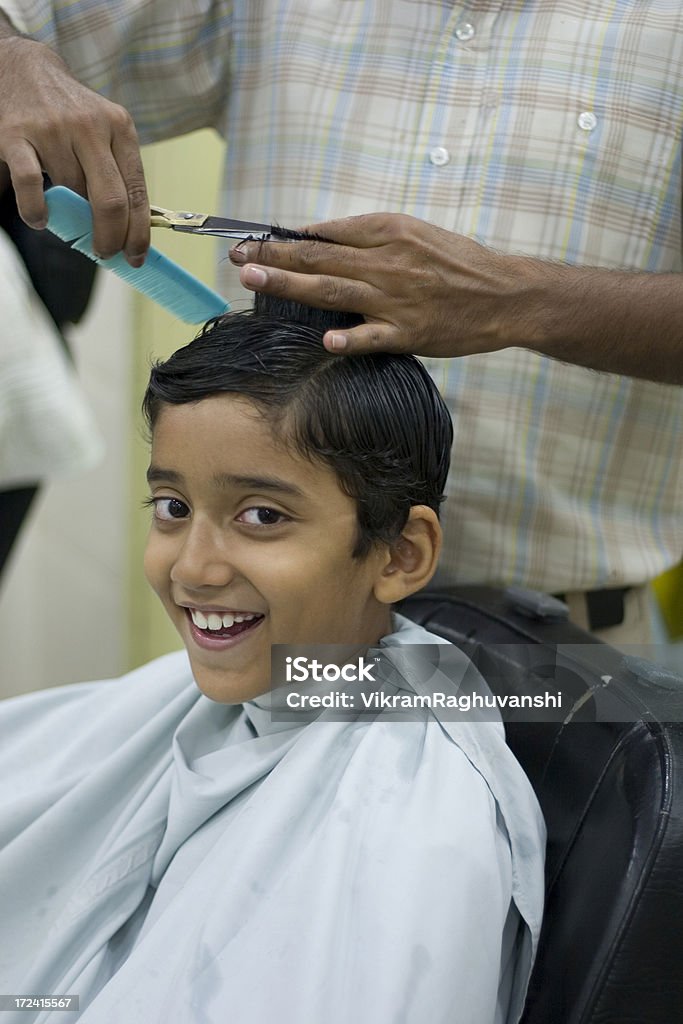 Young Cheerful Indian Boy Getting Hair Cut At Saloon Vertical Stock Photo -  Download Image Now - iStock