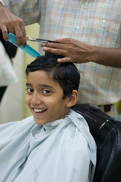 Young Cheerful Indian Boy Getting Hair Cut At Saloon Vertical Stock Photo - Download Image Now - iStock Young Cheerful Indian Boy Getting Hair Cut At Saloon Vertical Stock Photo - Download Image Now - iStock