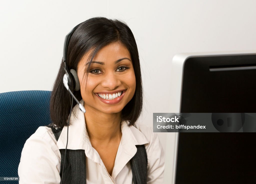 Lächelnd Kundenservice-Mitarbeiter - Lizenzfrei Attraktive Frau Stock-Foto