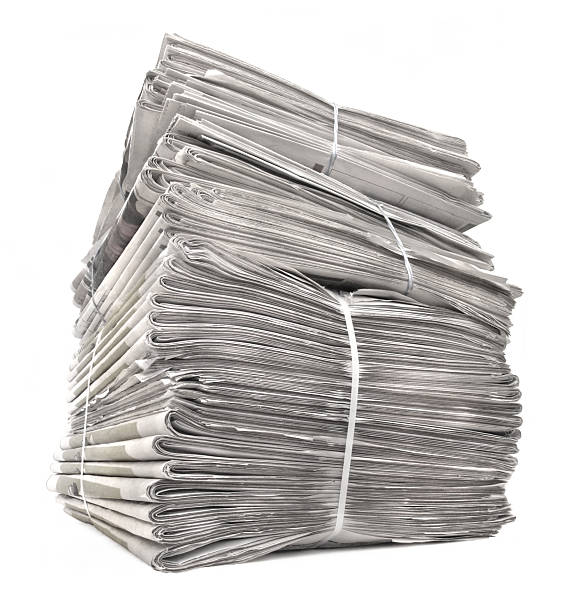 istock A stack of tied newspapers on white 172415770