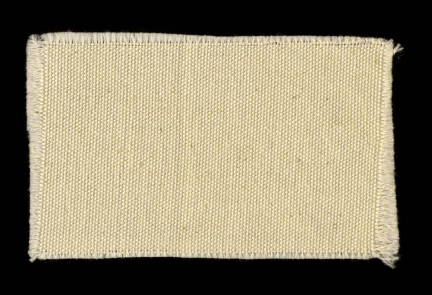 off-white frayed cotton swatch background texture This high resolution canvas fabric stock photo is ideal for backgrounds, textures, prints, websites and many other art image uses! fabric swatch isolated stock pictures, royalty-free photos & images