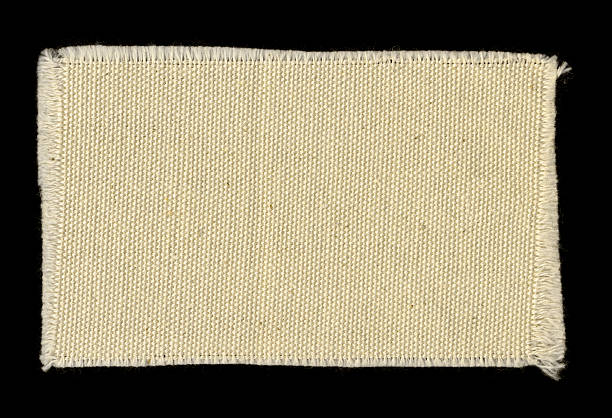 kremowa postrzępiony bawełna swatch tle, tekstura płótna - patched zdjęcia i obrazy z banku zdjęć