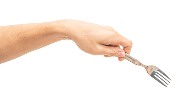 istock isolated of a man's hand holding a silver steel fork. 1724159013