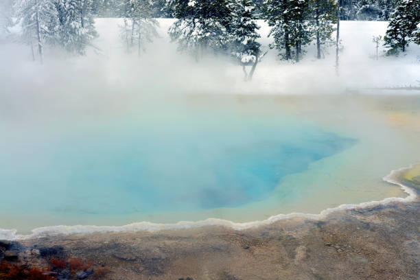 Geothermal pool in winter Yellowstone National Park steaming