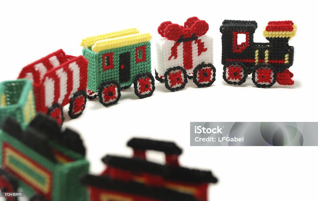 Needlework Train A collection of hand-made needlework train cars on a white background. Art And Craft Stock Photo