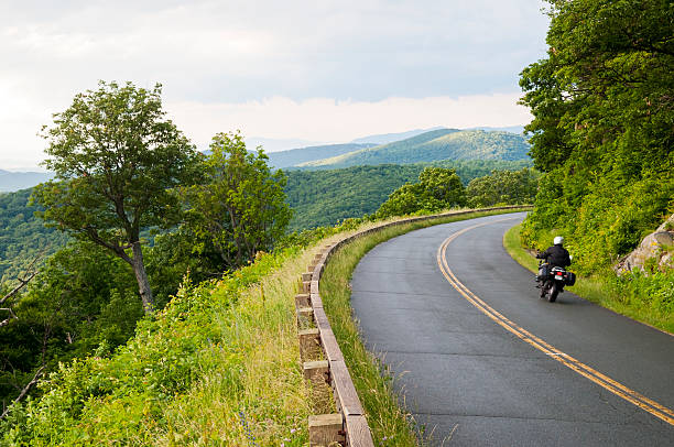 Motorcycle on the Blue Ridge Parkway Motorcyclist on the Blue Ridge Parkway in Virginia blue ridge parkway stock pictures, royalty-free photos & images