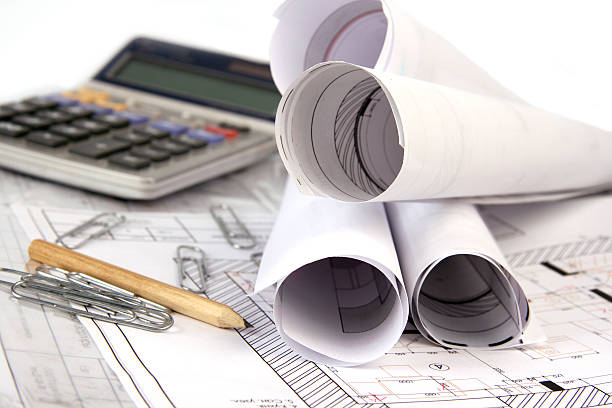Architectural Drafts Rolled Up With Drafting Supplies Stock Photo -  Download Image Now - iStock