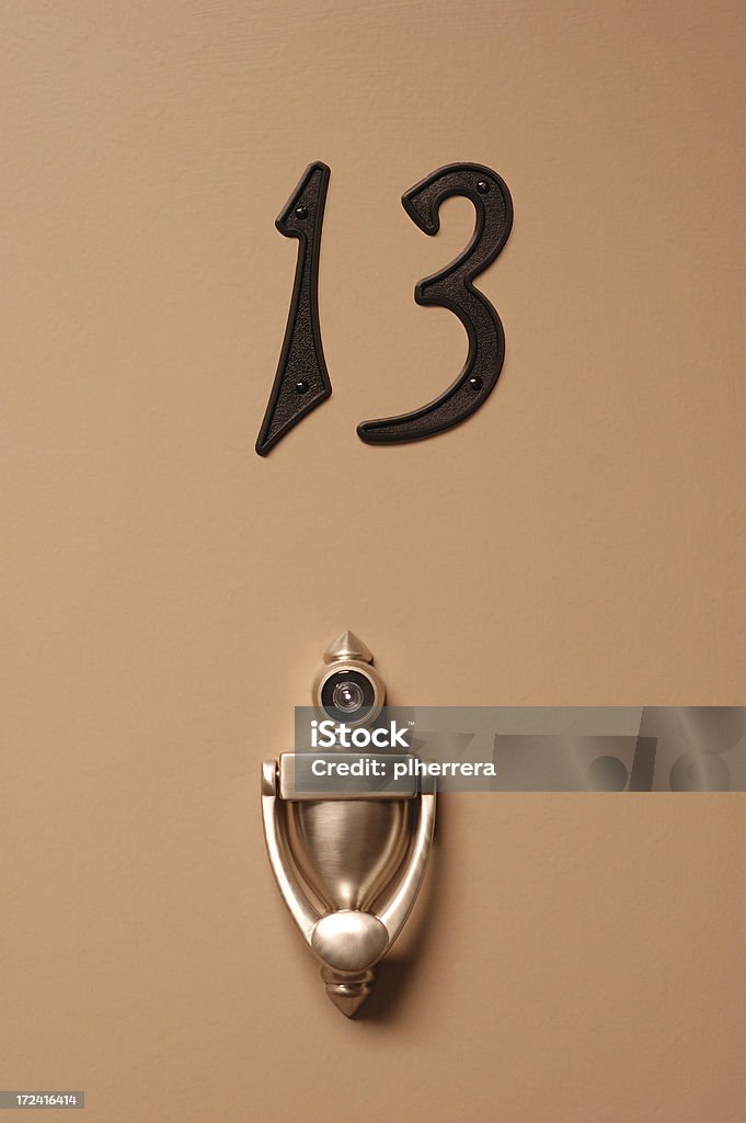 Unlucky Door 13 "Door with number 13, peep hole and knocker.related:" Adversity Stock Photo