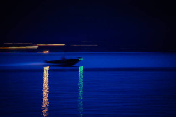 istock Speedboat Streak Across Nighttime Lake 1724164462