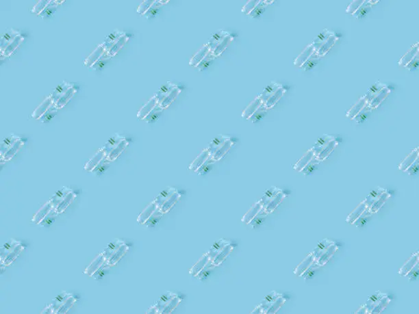 Photo of Seamless repetitive Vaccine on blue background