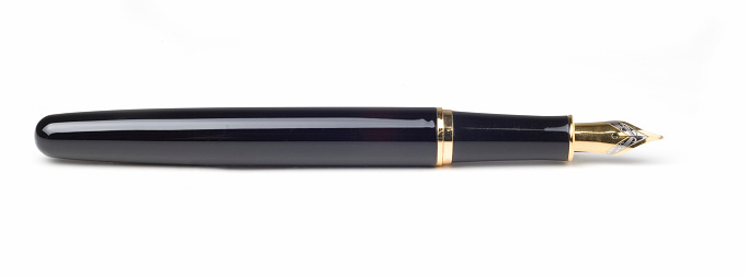 Vintage gold plated fountain pen isolated on a white background with clipping path