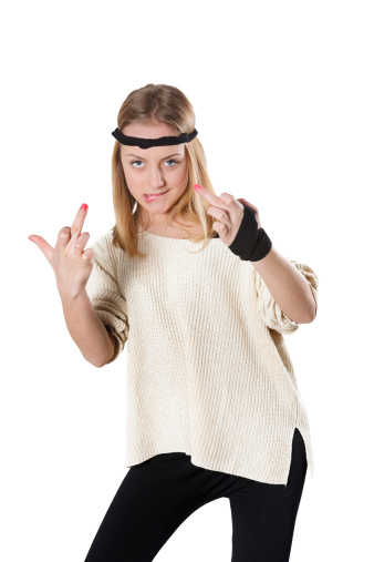 Photo of blonde and cute little Girl with Taped Hand and showing her middle fingers. Dressed in modern sports clothing and headband. Isolated on white background.See more images like this in:
