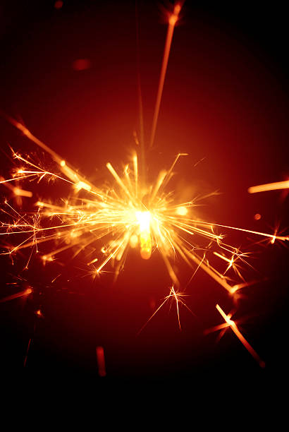 istock Christmas or celebration daisycutter, fire-cracker, sparkler... yellow glow on red 172417693