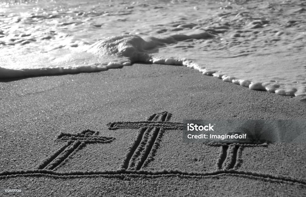 Easter Scene Three crosses in the sand. Cross Shape Stock Photo