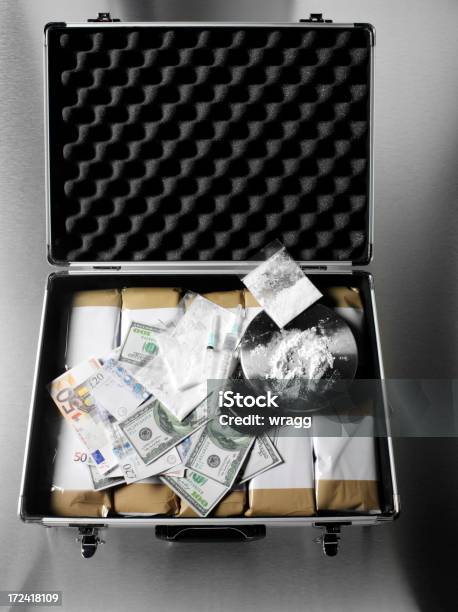 Drugs In A Briefcase With Dollars Euros And British Pounds Stock Photo - Download Image Now