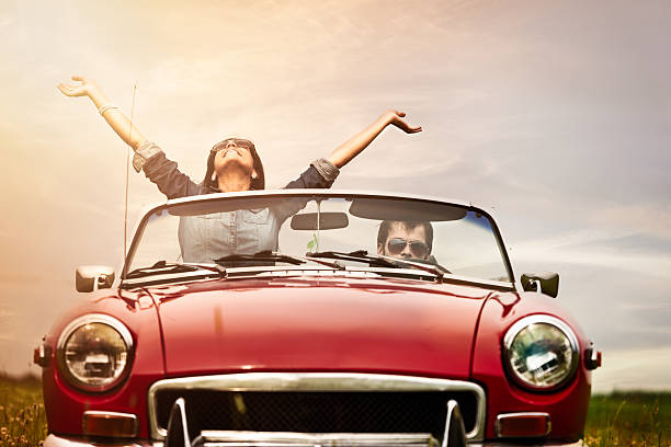 istock Young people in front seat of cabriolet 172418376