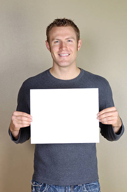 istock Signs - Handsome man holding blank white sign. 172419439