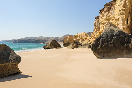 Rocks at surfer beach Praia do Castelejo near Sagres. West Atlantic coast of Algarve region, south of Portugal.