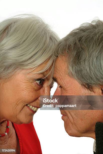 Photo libre de droit de Couple Senior Bumping Heads banque d'images et plus d'images libres de droit de Adulte - Adulte, Amour, Bonheur