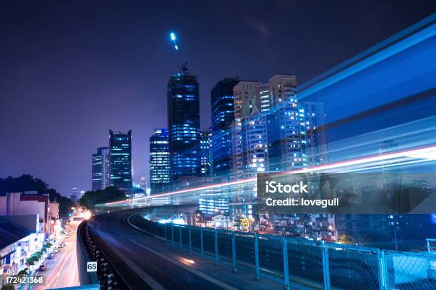 Motionblur Image Of Train In Modern City Stock Photo - Download Image Now - In A Row, Night, Office Building Exterior