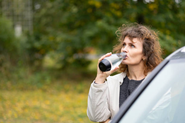 istock sustainability concepts: drinking water from a reusable bottle 1724218701