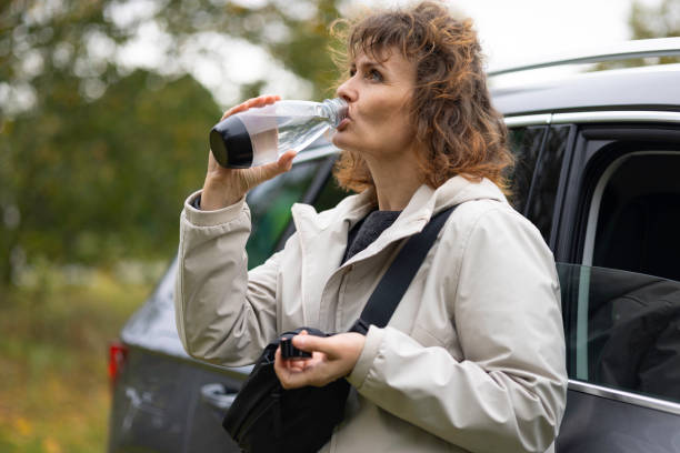 istock sustainability concepts: drinking water from a reusable bottle 1724218725
