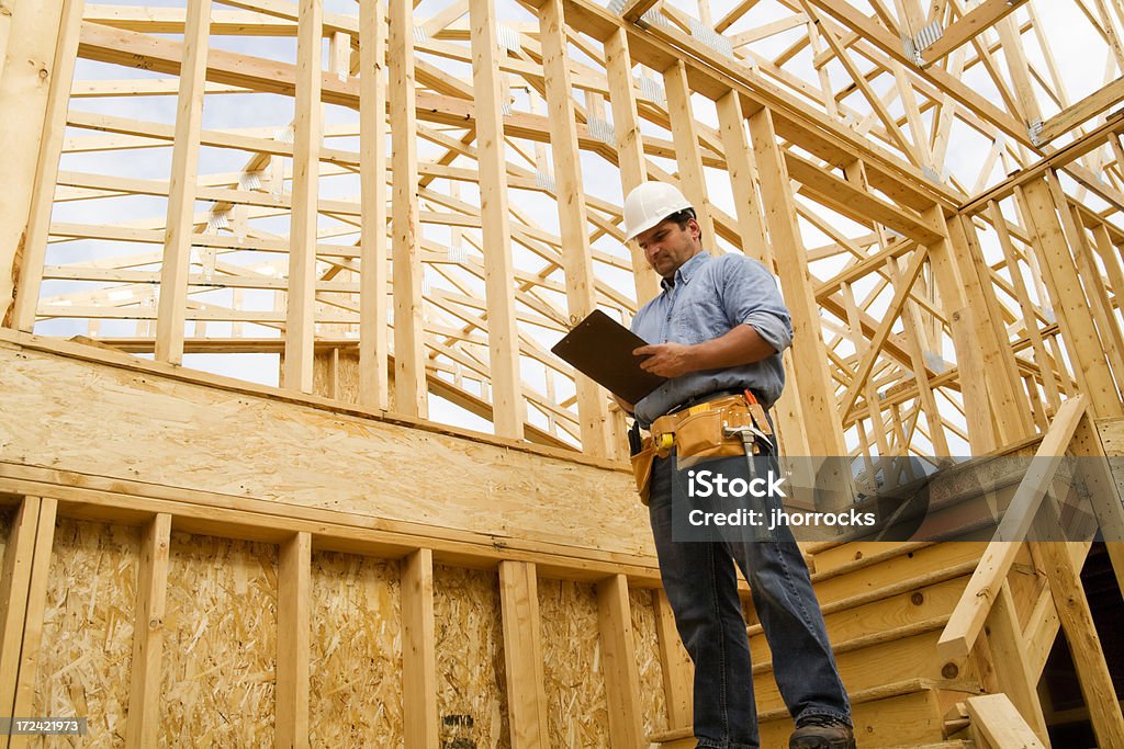 Construction Site Inspection Photo of a construction inspector taking notes. Building Contractor Stock Photo