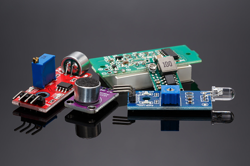 A set of various additional sensor modules for projects using open-source hardware and software. Close-up on a gray background.