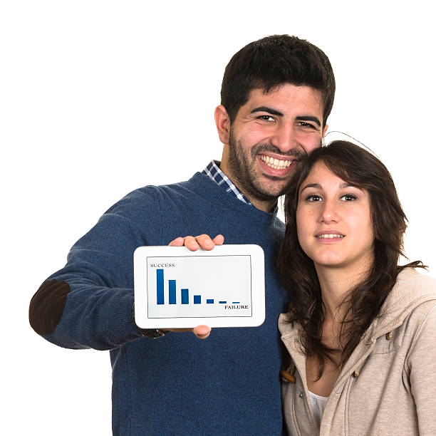istock couple showing his tablet 172422578