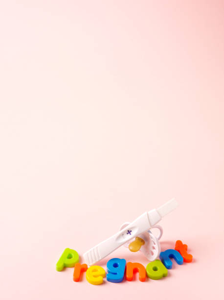 istock Magnetic Letters Spelling Pregnant and Pregnancy Test Results, 172423055