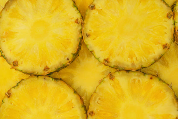 istock Pineapple juicy yellow slices as a background. 1724232455