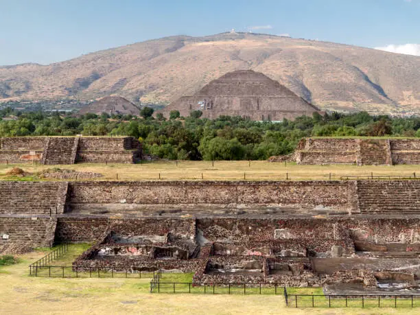 "The enormous Pyramid of the Sun - the third largest pyramid in the world - and behind it the slightly smaller Pyramid of the Moon. In the foreground in part of the citadel, another complex of temples and small pyramids.It is a Unesco World Heritage monument. Near Mexico City, Mexico."