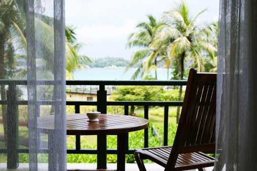 Lawn chair facing a great tropical sea view.