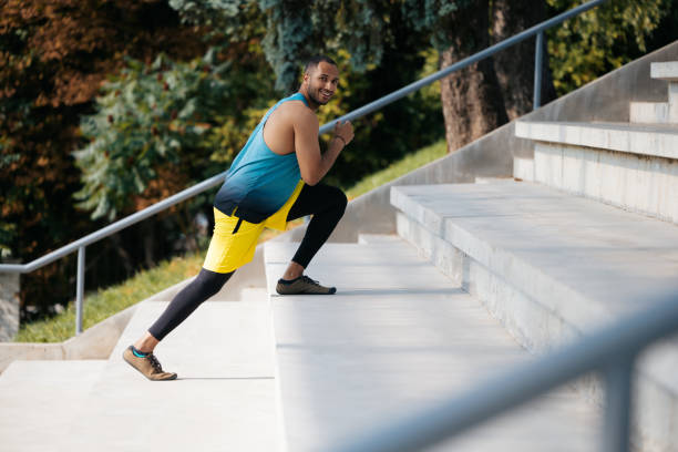 istock Dark-skinned athlete exercising on the stairs 1724239805