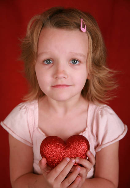istock Little girl with a heart - compassion 172424370