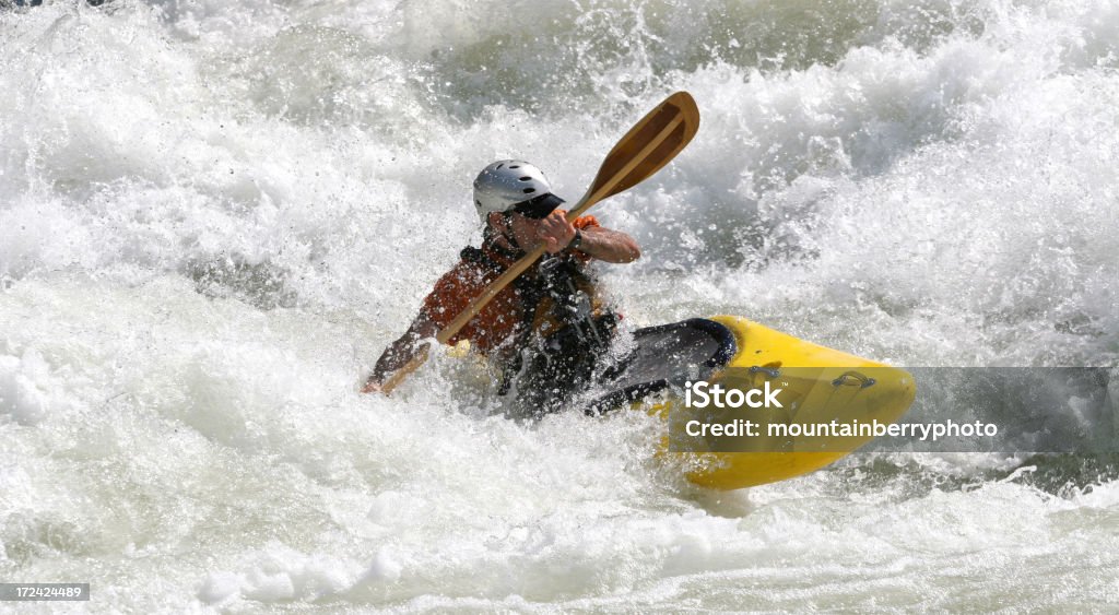 Whitewater Kayaker travels a class five rappids. Rapids - River Stock Photo
