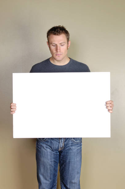 istock Signs - Handsome man holding blank white sign. 172424848