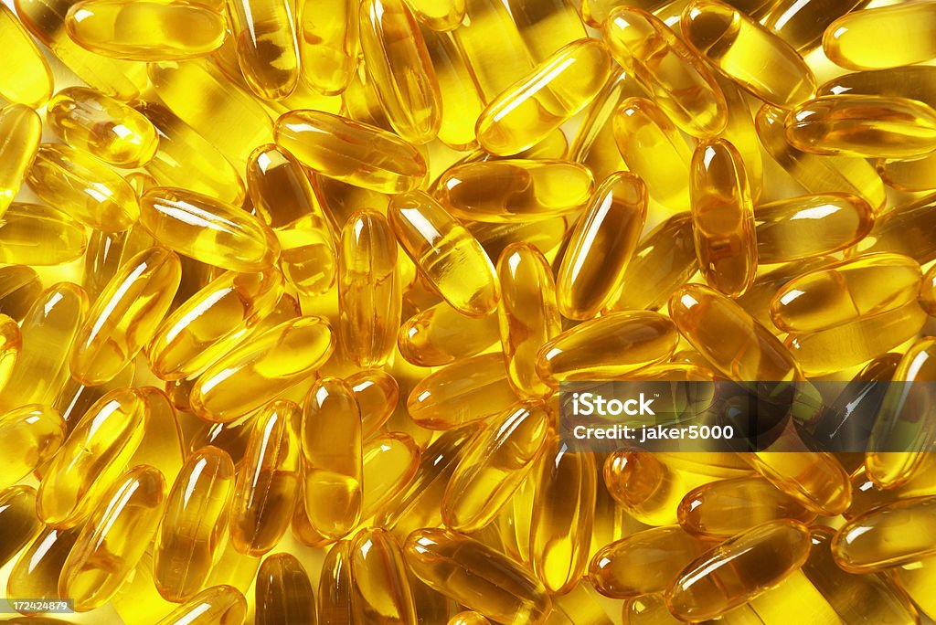 Cápsulas de aceite de pescado - Foto de stock de Aceite de pescado libre de derechos