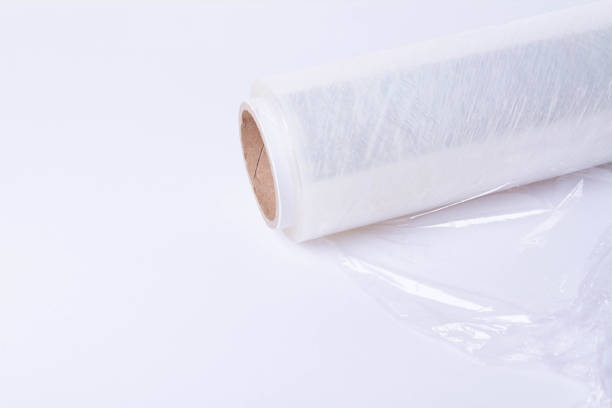 istock Packing the goods in a cardboard box and stretch film. Tools for packing parcels at the post office. 1724253977