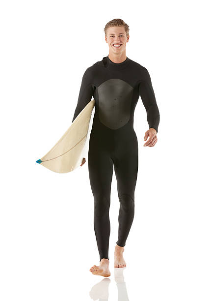 istock Smiling male surfer carrying a surfboard 172425684