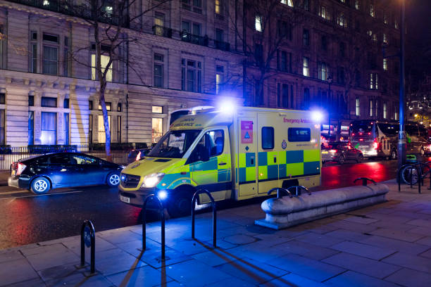 London, England - Dec 11, 2019: A London Emergency Ambulance on a road during the night