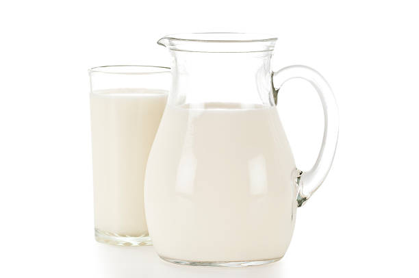 Pitcher and Glass Full Of Milk Pitcher and Glass Full Of Milk With Excellent Clipping Path Included jar of milk stock pictures, royalty-free photos & images