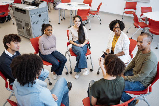 istock University students in campus. Students talking to female African professor during or after the lectures 1724262893