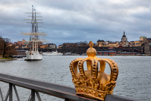 Gold crown on skeppsholmen bridge in Stockholm city in Sweden