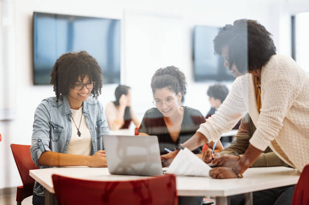 istock University students in campus. Students talking to female African professor during or after the lectures 1724263458